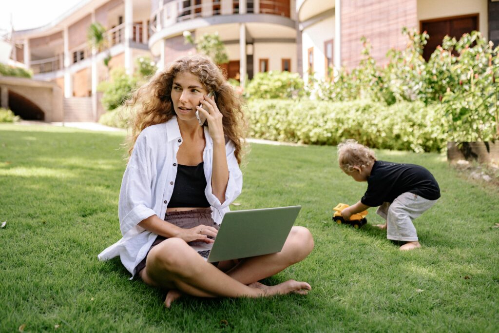 Single mother working remotely and spending quality time with her child